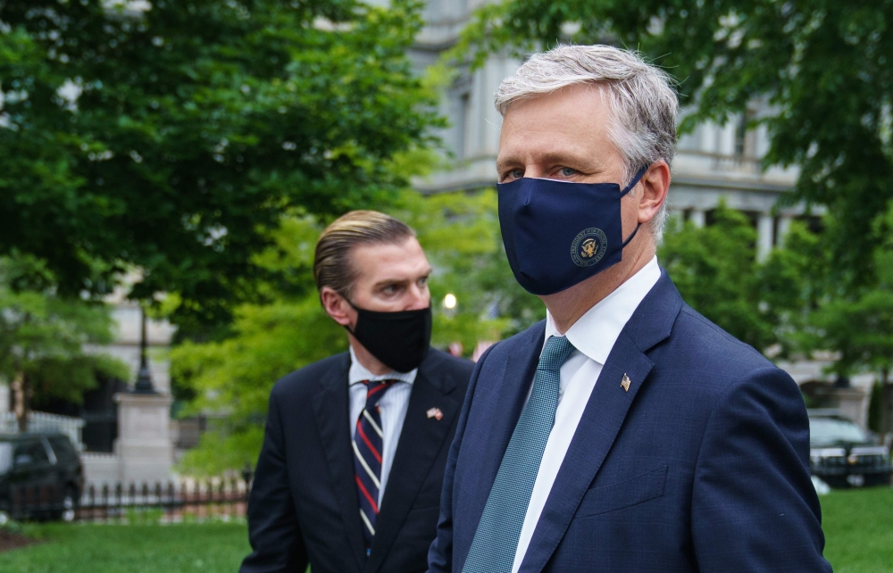 US National Security Advisor Robert O'Brien (R) is seen on the front driveway of the White House following an interview on May 24, 2020 in Washington,DC. / AFP / MANDEL NGAN