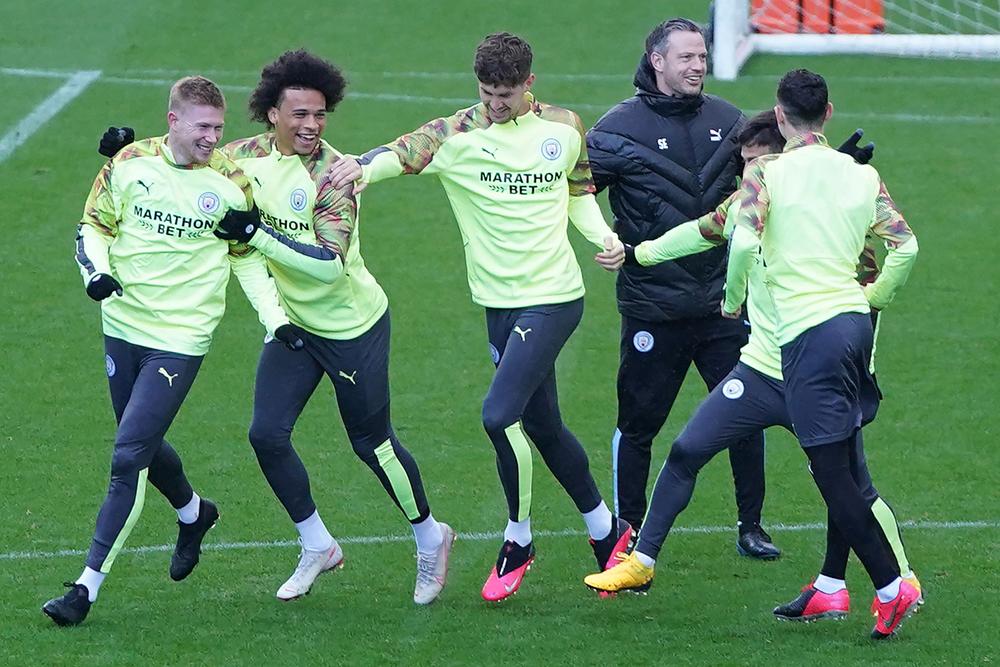 In this file photo taken on February 25, Manchester City’s players  attend a  team training session at City Football Academy in Manchester.