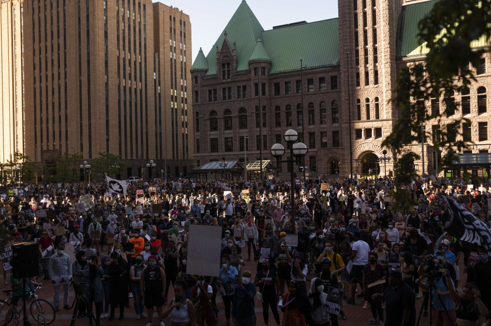 MINNEAPOLIS, MN - MAY 28: A large group of protesters gathers outside the Hennepin County Government Center on May 28, 2020 in Minneapolis, Minnesota. Police and protesters continued to clash for a third night after George Floyd was killed in police custo