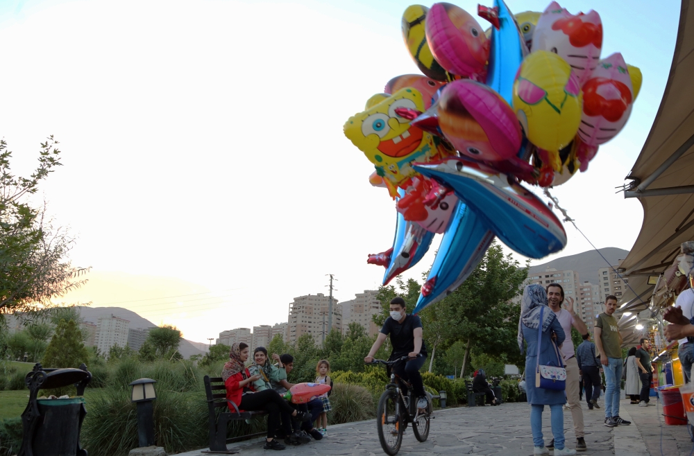 People spend time near the Chitgar Lake until late hours amid the novel coronavirus (COVID-19) pandemic despite of warnings in Iran's capital Tehran on May 28, 2020. (Fatemeh Bahrami - Anadolu Agency)