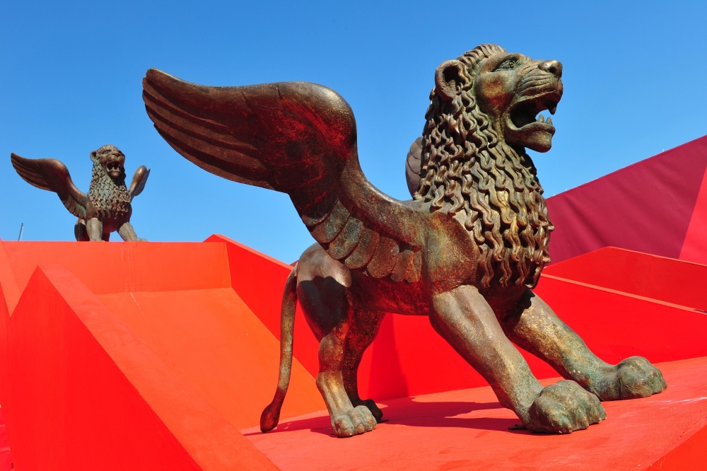(FILES) In this file photo taken on August 30, 2011 statues of golden lions are displayed near the festival's palace on the eve of the opening of the 68th Venice International Film Festival at Venice Lido. AFP / Alberto PIZZOLI