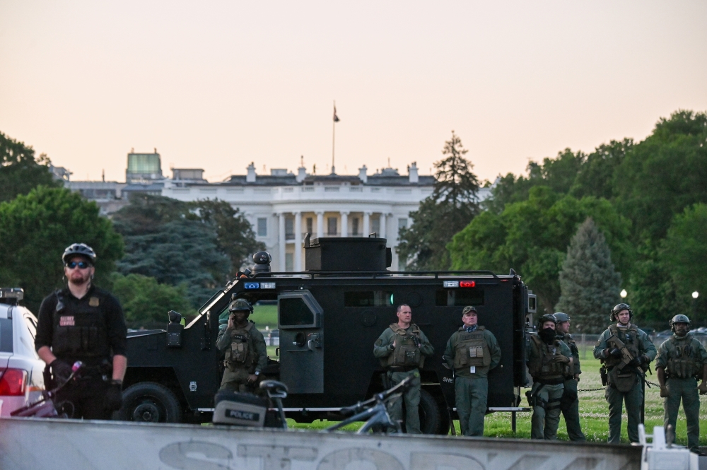 SWAT personnel stand with their vehicle outside the White House during a protest amid nationwide unrest over the death in Minneapolis police custody of George Floyd, in Washington, U.S., May 31, 2020. REUTERS/Erin Scott