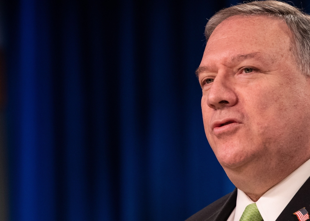 In this file photo US Secretary of State Mike Pompeo speaks to the press at the State Department in Washington, DC, on May 20, 2020. AFP / POOL / NICHOLAS KAMM