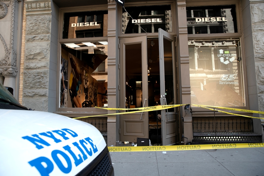 An NYPD van is seen parked outside the Diesel store after it was looted and damaged by some protesters after they participated in a march against the death in Minneapolis police custody of George Floyd, in the Manhattan borough of New York City, U.S., Jun