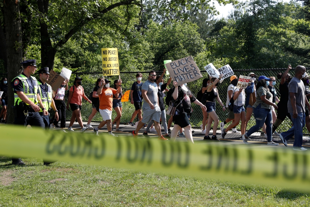 People attend a protest against racial inequality in the aftermath of the death in Minneapolis police custody of George Floyd, in Westbury, New York, U.S. June 10, 2020. REUTERS/Shannon Stapleton
