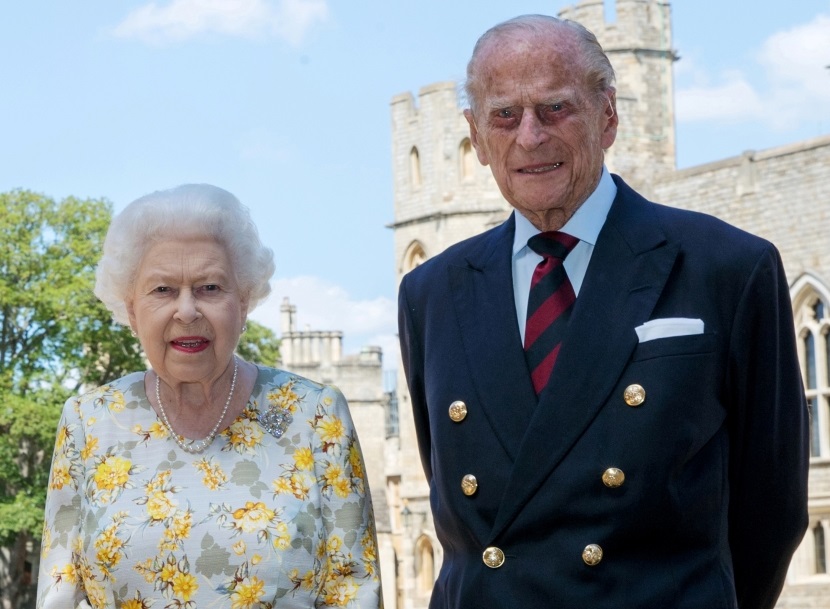 Britain's Queen Elizabeth II and Britain's Prince Philip, Duke of Edinburgh, poses in the quadrangle of Windsor Castle on June 6, 2020. Picture released on June 9, 2020, ahead of Prince Philip’s 99th birthday. Steve Parsons/PA Wire/Pool via REUTERS