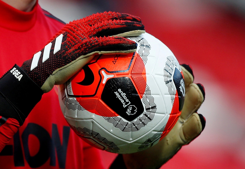 General view of a match ball held by Manchester United's David de Gea during the warm up before the match Action Images via Reuters/Lee Smith