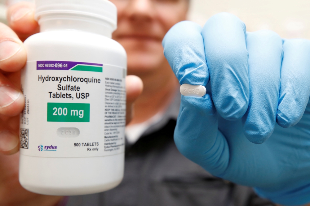 FILE PHOTO: The drug Hydroxychloroquine, pushed by U.S. President Donald Trump and others in recent months as a possible treatment to people infected with the coronavirus disease (COVID-19), is displayed by a pharmacist at the Rock Canyon Pharmacy in Prov