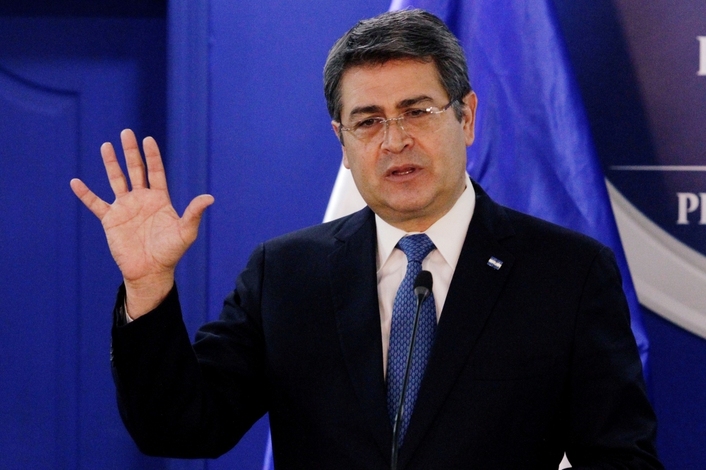 FILE PHOTO: Honduras' President Juan Orlando Hernandez speaks during a joint message with U.S. Department of Homeland Security (DHS) acting Secretary Chad Wolf (not pictured), at the Presidential House in Tegucigalpa, Honduras January 9, 2020. REUTERS/Jor