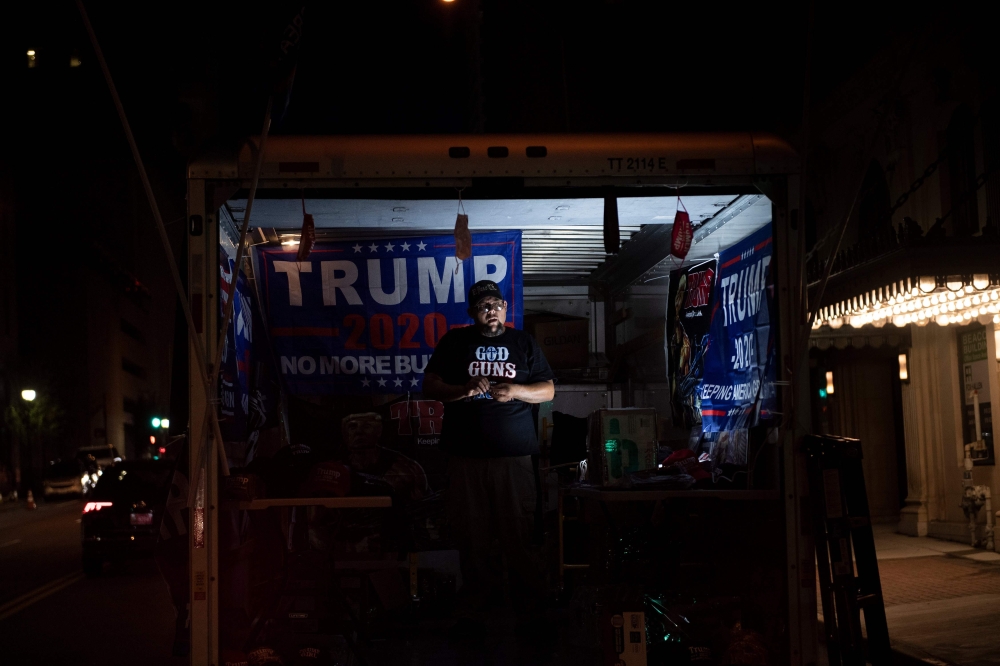 A vender sets up while waiting for tomorrow's rally with US President Donald Trump in Tulsa, Oklahoma, June 19, 2020. AFP / Brendan Smialowski