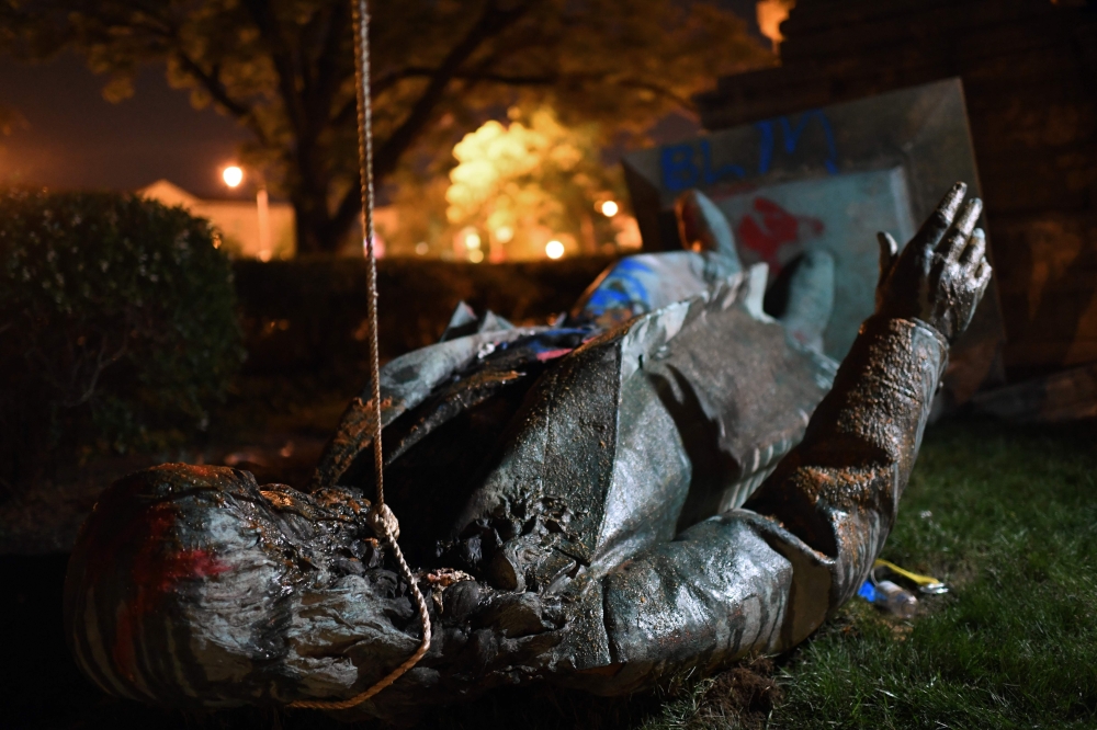 The statue of Confederate general Albert Pike is pictured after it was toppled by protesters at Judiciary square in Washington, DC on late June 19, 2020. AFP / Eric Baradat 