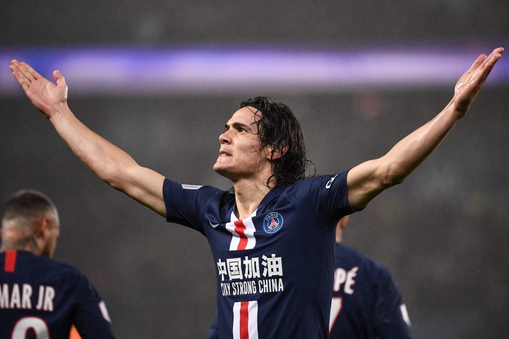 (FILES) In this file photo taken on February 23, 2020 Paris Saint-Germain's Uruguayan forward Edinson Cavani reacts after scoring a goal during the French L1 football match between Paris Saint-Germain (PSG) and Girondins de Bordeaux at the Parc des Prince