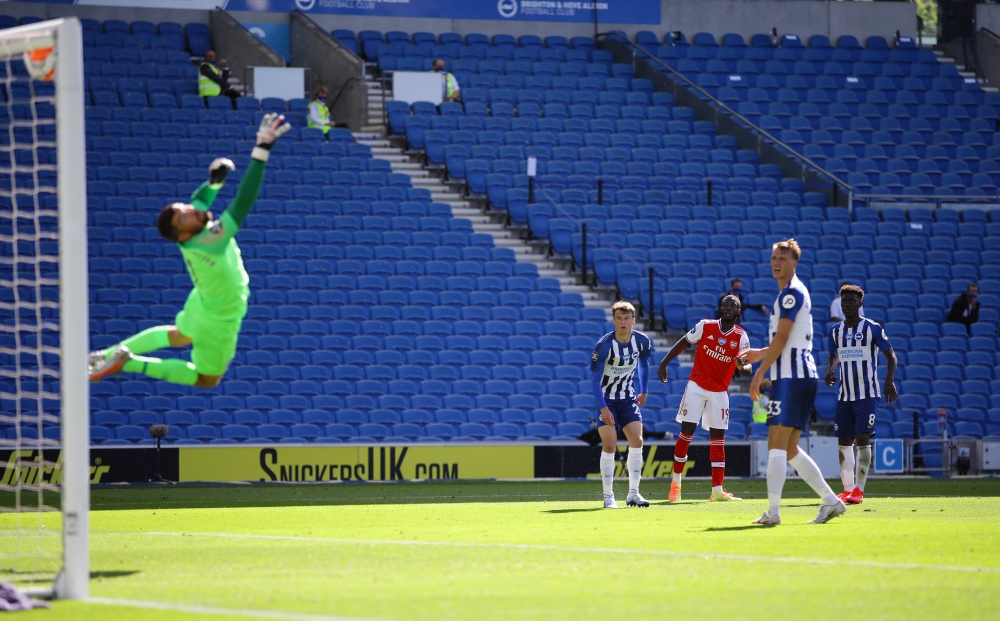 Arsenal's Nicolas Pepe scores their first goal as play resumes behind closed doors following the outbreak of the coronavirus disease (COVID-19) Richard Heathcote/Pool via REUTERS