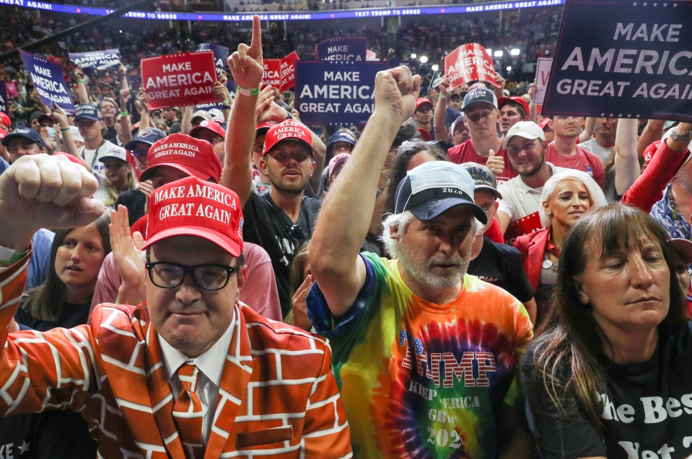 Supporters of U.S. President Donald Trump without protective face masks crowd near the stage for the president's nearly two hour long speech at his first re-election campaign rally in several months in the midst of the coronavirus disease (COVID-19) outbr