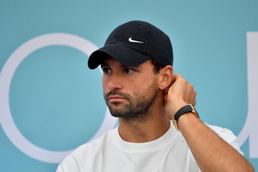 (FILES) In this file photo taken on June 12, 2020 Bulgarian tennis player Grigor Dimitrov attends a press conference of the Adria Tour, a charity exhibition hosted by Serbian tennis player Novak Djokovic, on June 12, 2020 in Belgrade.  / Andrej ISAKOVIC
