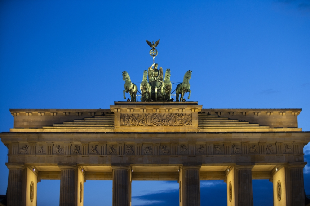 The historical Brandenburg Gate is seen as an entertainment crew performs a light show in Berlin, Germany on June 22, 2020.  Abdulhamid Ho?ba? - Anadolu