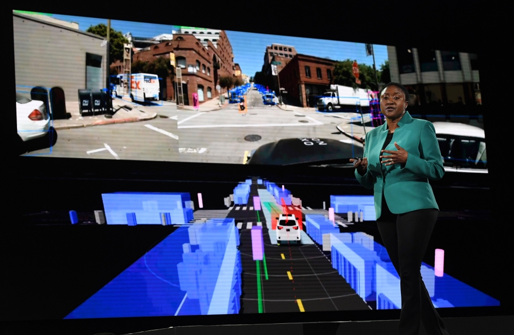 (FILES) In this file photo taken on June 6, 2019 Aicha Evans who is the CEO of the self-driving technology development company Zoox, talks about autonomous cars during a keynote session at the Amazon Re:MARS conference on robotics and artificial intellige