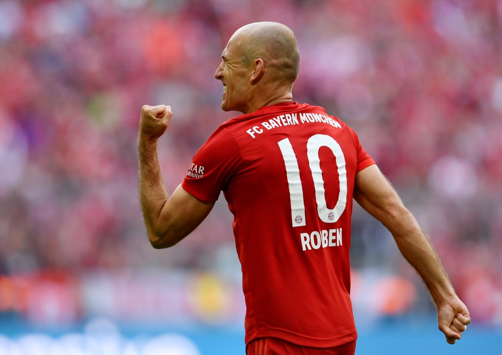 Bayern Munich's Arjen Robben celebrates scoring their fifth goal REUTERS/Andreas Gebert DFL regulations prohibit any use of photographs as image sequences and/or quasi-video/File Photo
