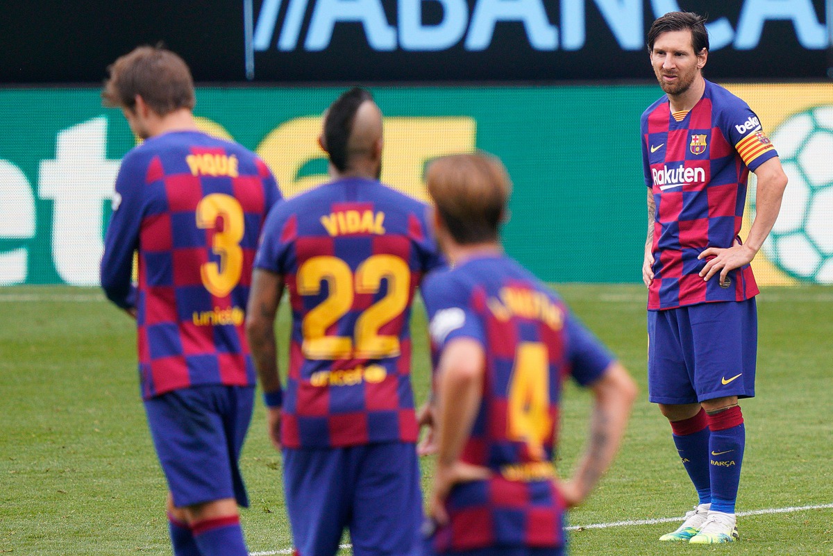 Barcelona's Argentine forward Lionel Messi (R) reacts during the Spanish League football match between Celta Vigo and Barcelona at the Balaidos stadium in Vigo on June 27, 2020. (AFP)