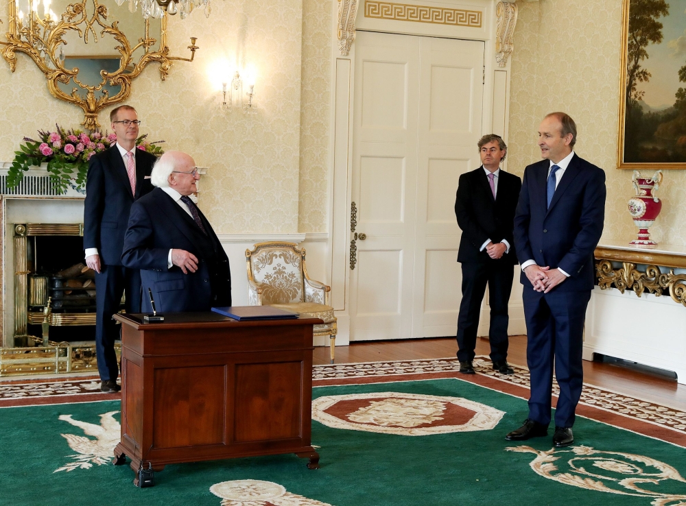 Ireland's new prime minister Micheal Martin (R) attends a meeting with Ireland's President Michael D. Higgins (L) to be formally appointed at Aras an Uachtarain in Dublin on June 27, 2020.AFP / MAXWELLS