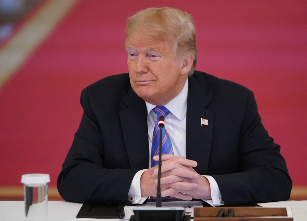 US President Donald Trump looks on during an American Workforce Policy Advisory Board Meeting in the East Room of the White House in Washington, DC on June 26, 2020. / AFP / MANDEL NGAN
