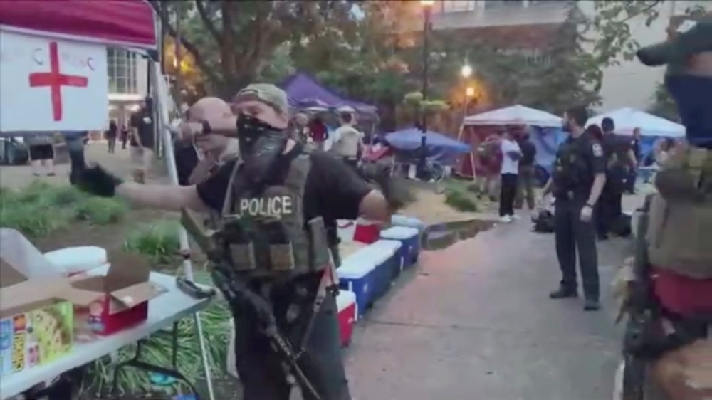 A police officer, wearing a tactical vest, gestures for people to step back after a fatal shooting at Jefferson Square Park, in Louisville, Kentucky, U.S., June 27, 2020 in this still image obtained from social media video. Maxwell Mitchell via REUTERS 