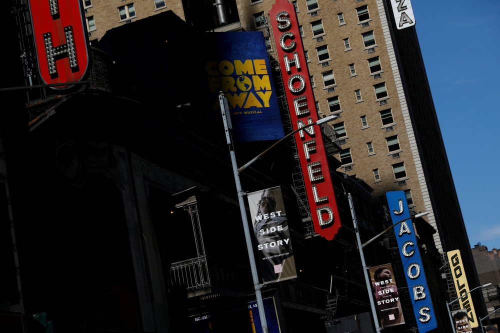 FILE PHOTO: A row of closed theaters are seen in the Broadway district due the outbreak of the coronavirus disease (COVID-19) in Manhattan, New York City, U.S., May 15, 2020. REUTERS/Andrew Kelly/File Photo
