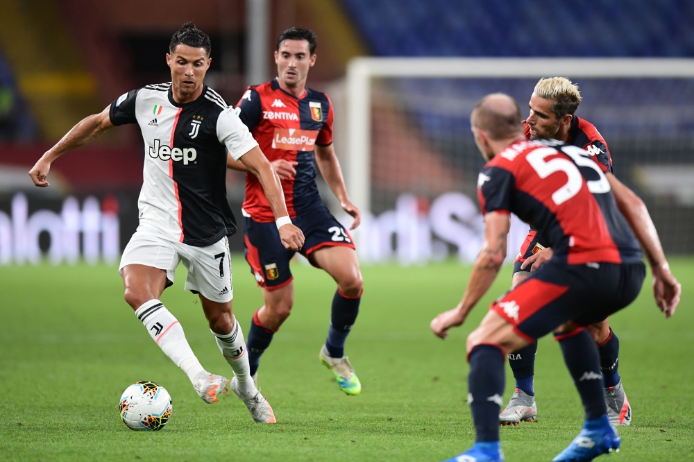 Juventus' Portuguese forward Cristiano Ronaldo controls the ball during the Italian Serie A football match Genoa vs Juventus played on June 30, 2020 behind closed doors at the Luigi-Ferraris stadium in Genoa. AFP / Miguel MEDINA