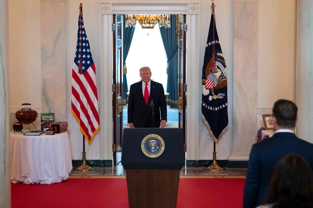 US President Donald Trump arrives to speak at a Spirit of America showcase event to spotlight small businesses in the grand foyer of the White House, in Washington, DC, on July 2, 2020. / AFP / JIM WATSON
