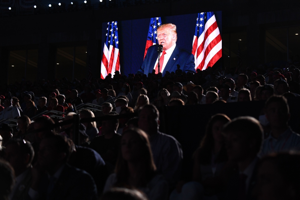 US President Donald Trump is shown on a screen as he speaks during the Independence Day events at Mount Rushmore National Memorial in Keystone, South Dakota. / AFP / SAUL LOEB
