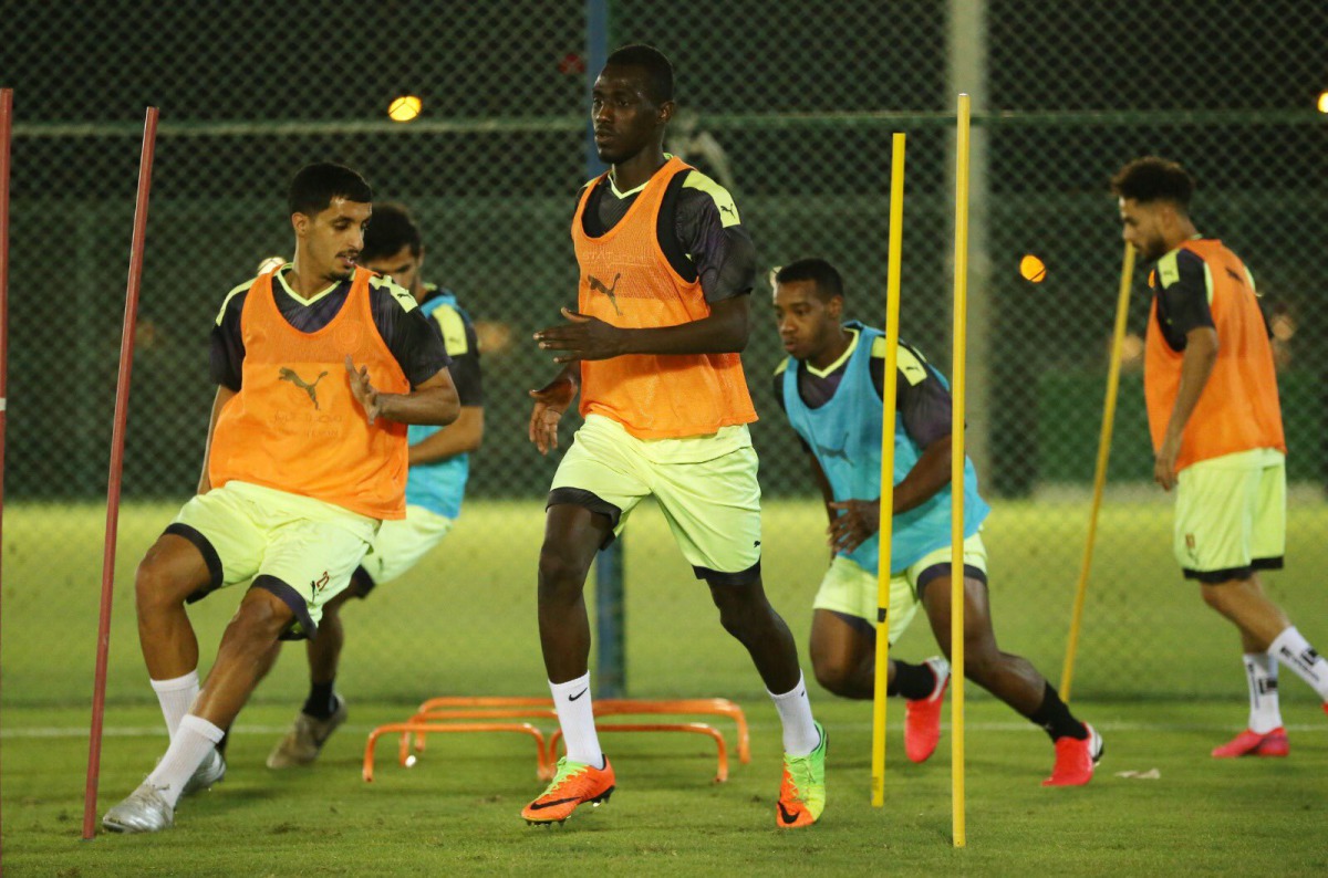 Al Duhail's star striker Almoez Ali (centre) and his teammates in action during a training session held yesterday.