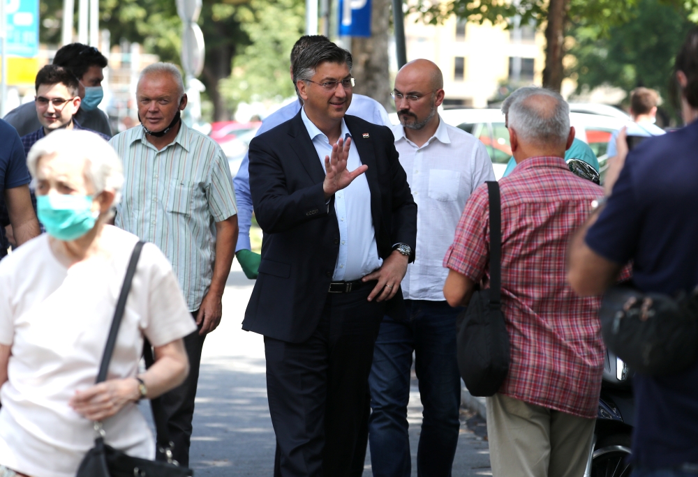 Croatian Prime Minister and the leader of Croatian Democratic Union (HDZ) Andrej Plenkovic waves as he arrives to cast his ballot during parliamentary election, amid the spread of the coronavirus disease (COVID-19), in Zagreb, Croatia, July 5, 2020. REUTE