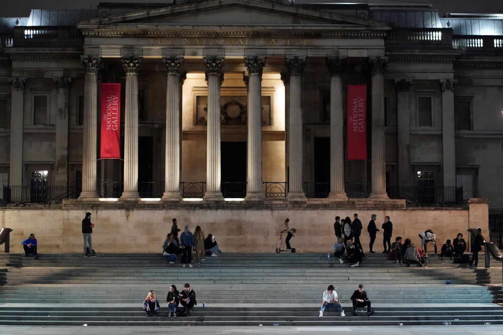People gather in Trafalgar Square, as restrictions are eased following the outbreak of the coronavirus disease (COVID-19), in London, Britain July 4, 2020. REUTERS/Henry Nicholls