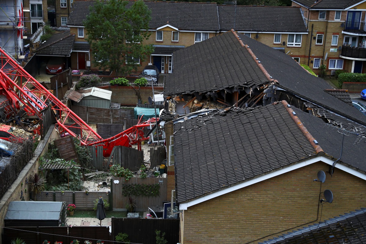 A collapsed crane is seen near a construction site in Bow, east London, Britain, July 8, 2020. REUTERS/Hannah McKay
