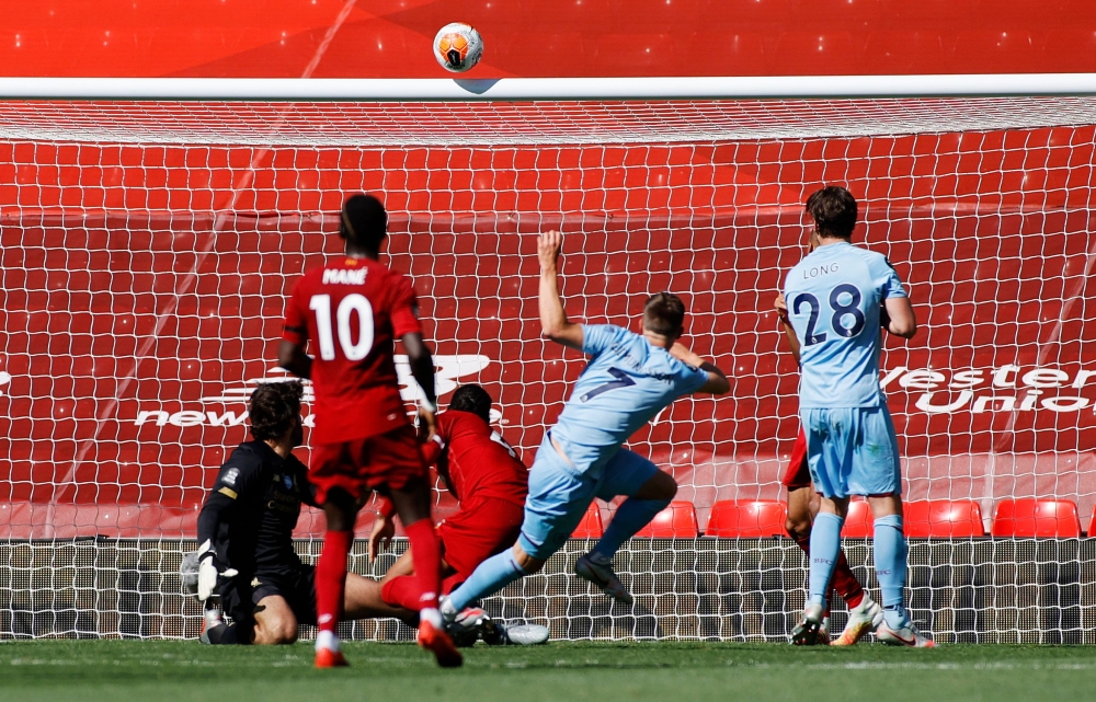 Anfield, Liverpool, Britain - July 11, 2020 Burnley's Johann Berg Gudmundsson shoots against the crossbar, as play resumes behind closed doors following the outbreak of the coronavirus disease (COVID-19) Pool via REUTERS/Phil Noble 