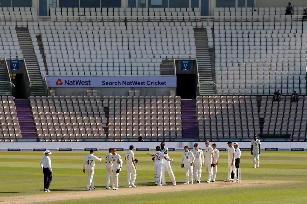 West Indies' Jason Holder (centre right) and West Indies' John Campbell (centre left) celebrate after West Indies win the test match on the fifth day of the first Test cricket match between England and the West Indies at the Ageas Bowl in Southampton, sou