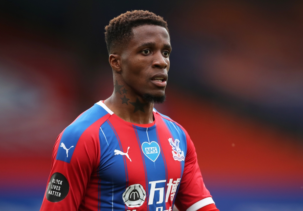 Soccer Football - Premier League - Crystal Palace v Chelsea - Selhurst Park, London, Britain - July 7, 2020 Crystal Palace's Wilfried Zaha, as play resumes behind closed doors following the outbreak of the coronavirus disease (COVID-19) REUTERS / Peter Cz