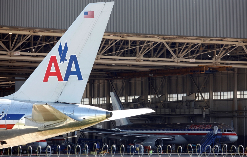 FILE PHOTO: An American Airlines airliner sits near a hanger at Dallas/Fort Worth International Airport, Texas April 4, 2012. REUTERS/Tim Sharp/File Photo