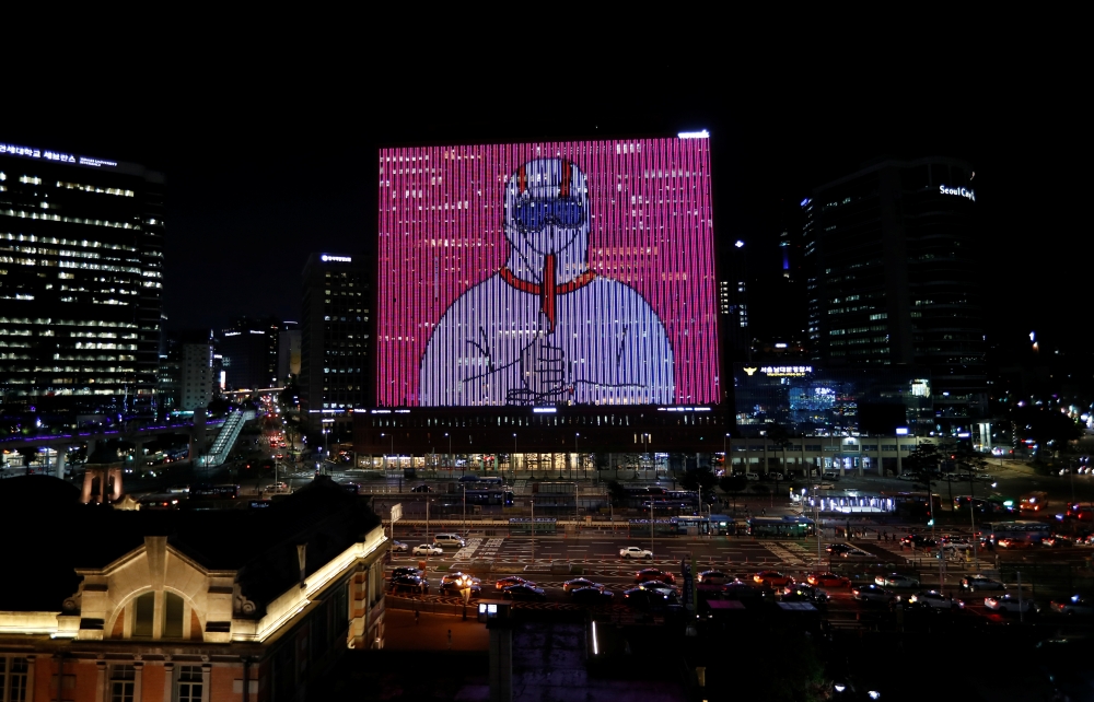 The exterior of a building is illuminated showing messages to support the country, as measures to avoid the spread of the coronavirus disease (COVID-19) continue, in Seoul, South Korea, July 7, 2020. REUTERS/Kim Hong-ji