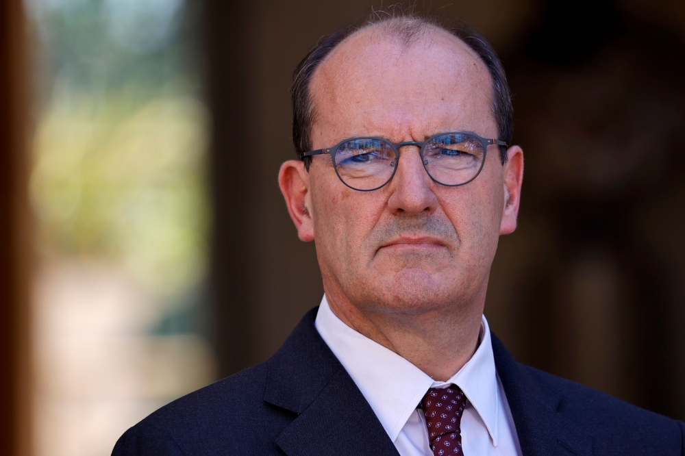 French Prime Minister Jean Castex looks on after signing the wage agreements as part of the 'Segur de la Sante' (general talks on Health reforms) aimed at improving working conditions, salaries and patient care in the medical sector, at the Hotel Matignon