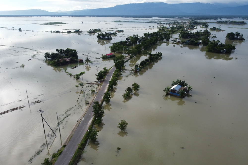 In this aerial photo inundated houses are seen in Sunamgong on July 14, 2020. Almost four million people have been hit by monsoon floods in South Asia, officials said July 14, with a third of Bangladesh already underwater from some of the heaviest rains i