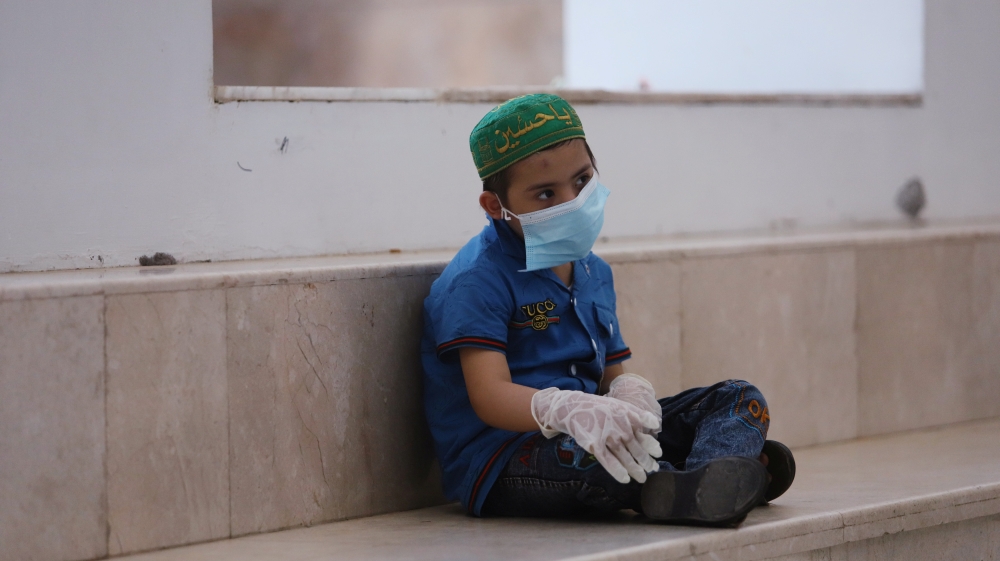 A child who suffers from cancer sits in a corridor at the Children's Hospital for Cancer Diseases, amid the spread of the coronavirus disease (COVID-19), in Basra, Iraq July 9, 2020. Picture taken July 9, 2020. REUTERS/Essam Al-Sudani