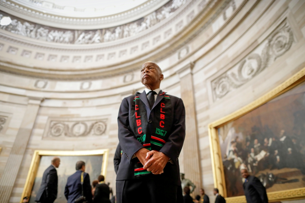 FILE PHOTO: Rep. John Lewis (D-GA) and other members of the Congressional Black Caucus wait in the U.S. Capitol Rotunda to enter memorial services for Rep. Elijah Cummings (D-MD) as a group at the U.S. Capitol in Washington, U.S. October 24, 2019. Pablo M