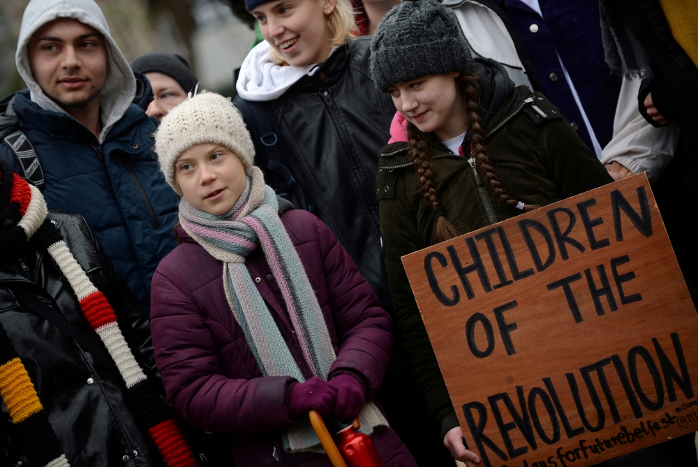 Swedish climate activist Greta Thunberg takes part in a protest outside the EU Council as EU environment ministers meet in Brussels, Belgium, March 5, 2020. REUTERS/Johanna Geron/File Photo
