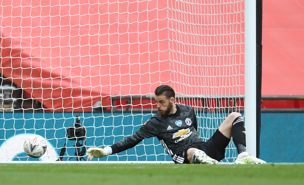 FILE PHOTO: Wembley Stadium, London, Britain - July 19, 2020 Chelsea's Olivier Giroud (not pictured) scores their first goal past Manchester United's David de Gea. Pool via REUTERS/Andy Rain/File Photo