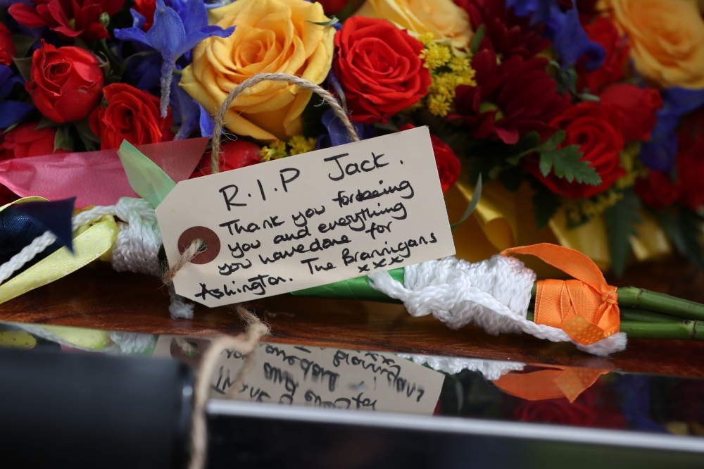 Floral tributes and messages of condolence are pictured as the funeral cortege of British football legend Jack Charlton arrives at the West Road Crematorium, in Newcastle om July 21, 2020. Jack Charlton who was born in Ashington, died on 10th July aged 85