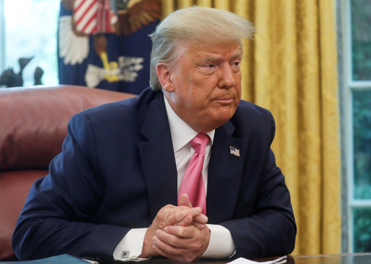 U.S. President Donald Trump speaks about legislation for additional coronavirus aid in the Oval Office at the White House in Washington, U.S., July 20, 2020. REUTERS/Leah Millis
