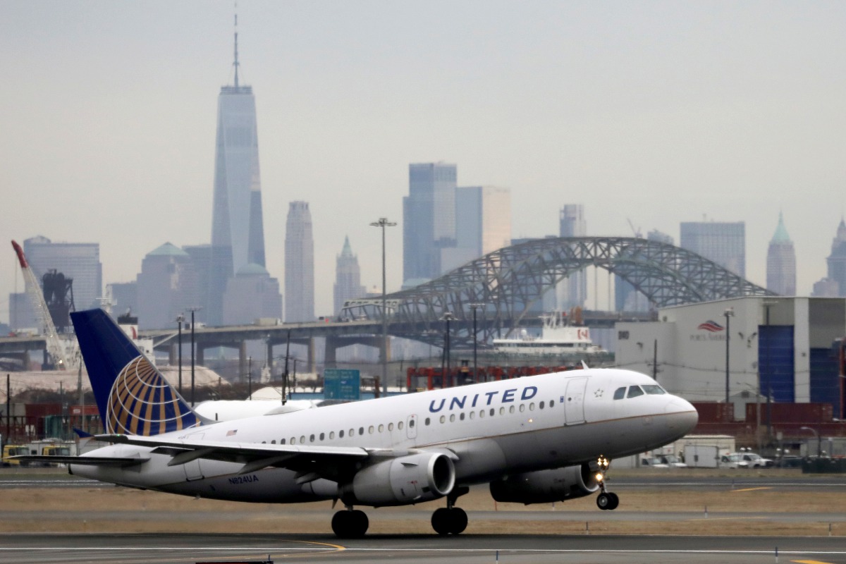 FILE PHOTO: A united airlines passenger jet takes off with New York City as a backdrop, at Newark Liberty International Airport, New Jersey, U.S. December 6, 2019. REUTERS/Chris Helgren/File Photo
