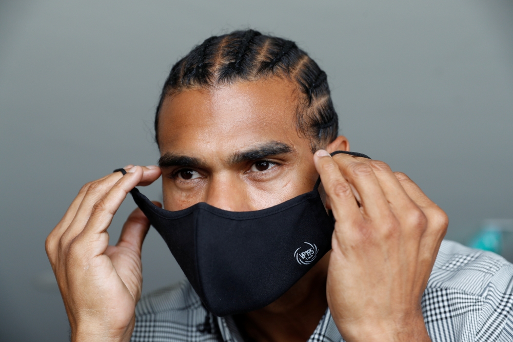 Former boxing heavyweight world champion David Haye poses for a photograph following the launch of his premium range of high-tech face masks, ahead of the British Government's law on wearing face masks in shops coming into effect on Friday 24th July, amid