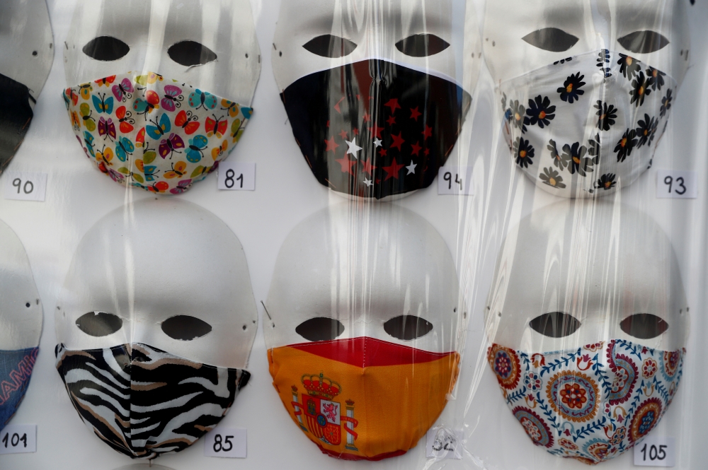 Protective masks are displayed in a store, amid the coronavirus disease (COVID-19) outbreak, in Madrid, Spain, June 30, 2020. REUTERS/Susana Vera/File Photo